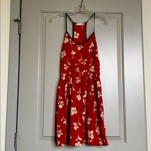 A lightweight burnt orange floral dress.